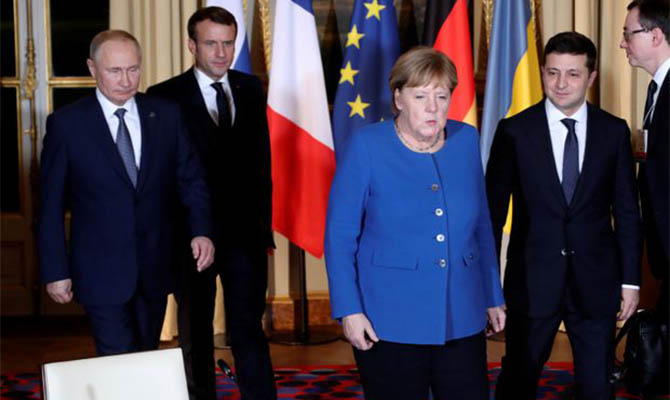 Меркель признала Путина победителем на саммите в Париже